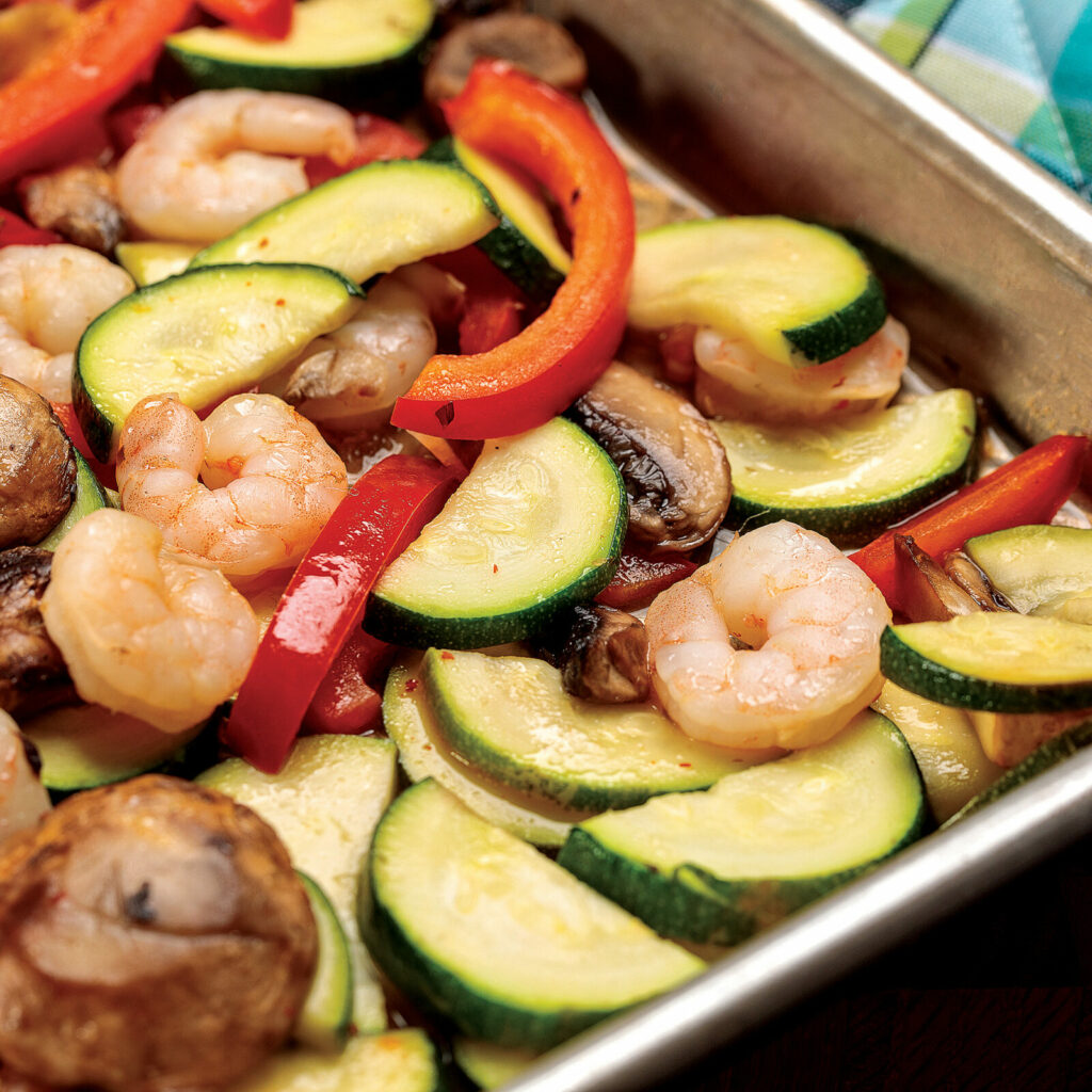 A pan of vegetables and shrimp